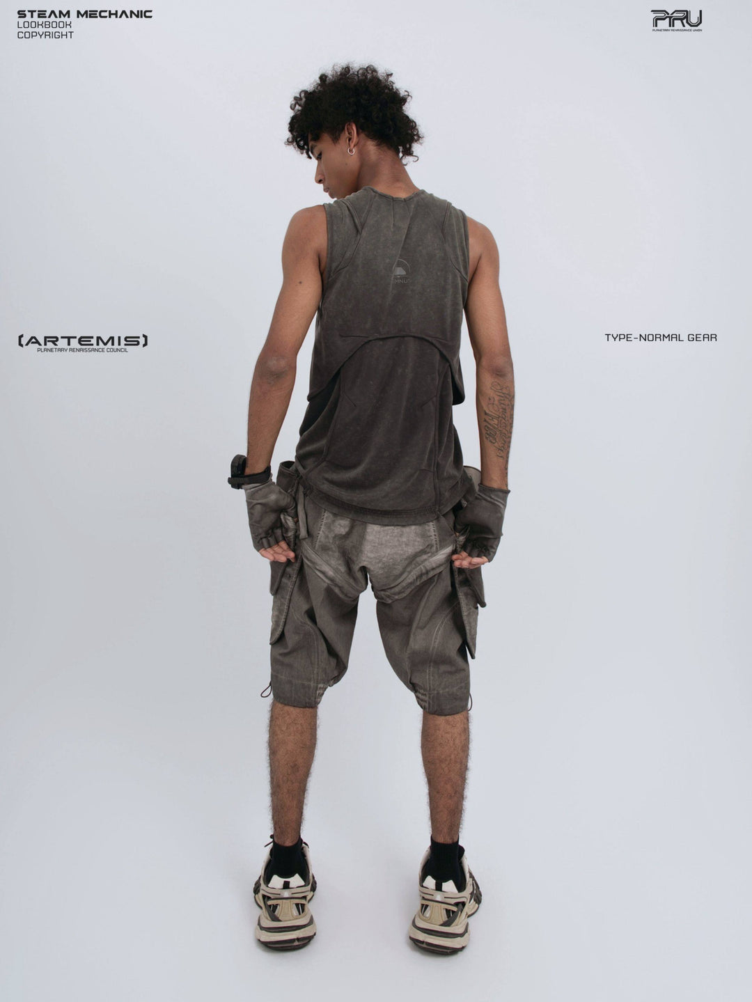 RIFT ARC deconstructed tank in washed gray — full-length back modeled view with head turned