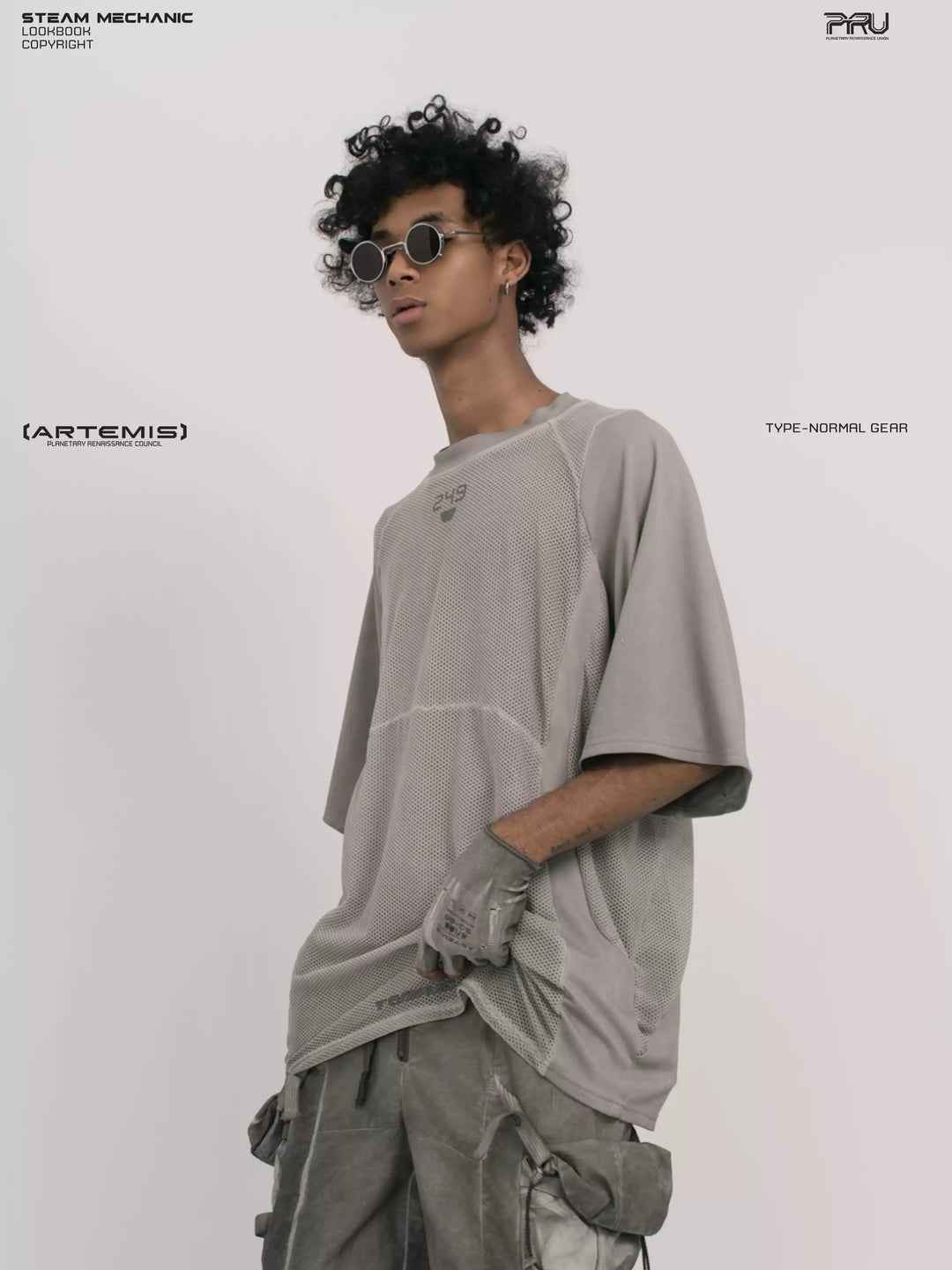 STARFIELD WELDER lunar sea gray distressed mesh tee — three-quarter modeled close-up with one hand in a pocket