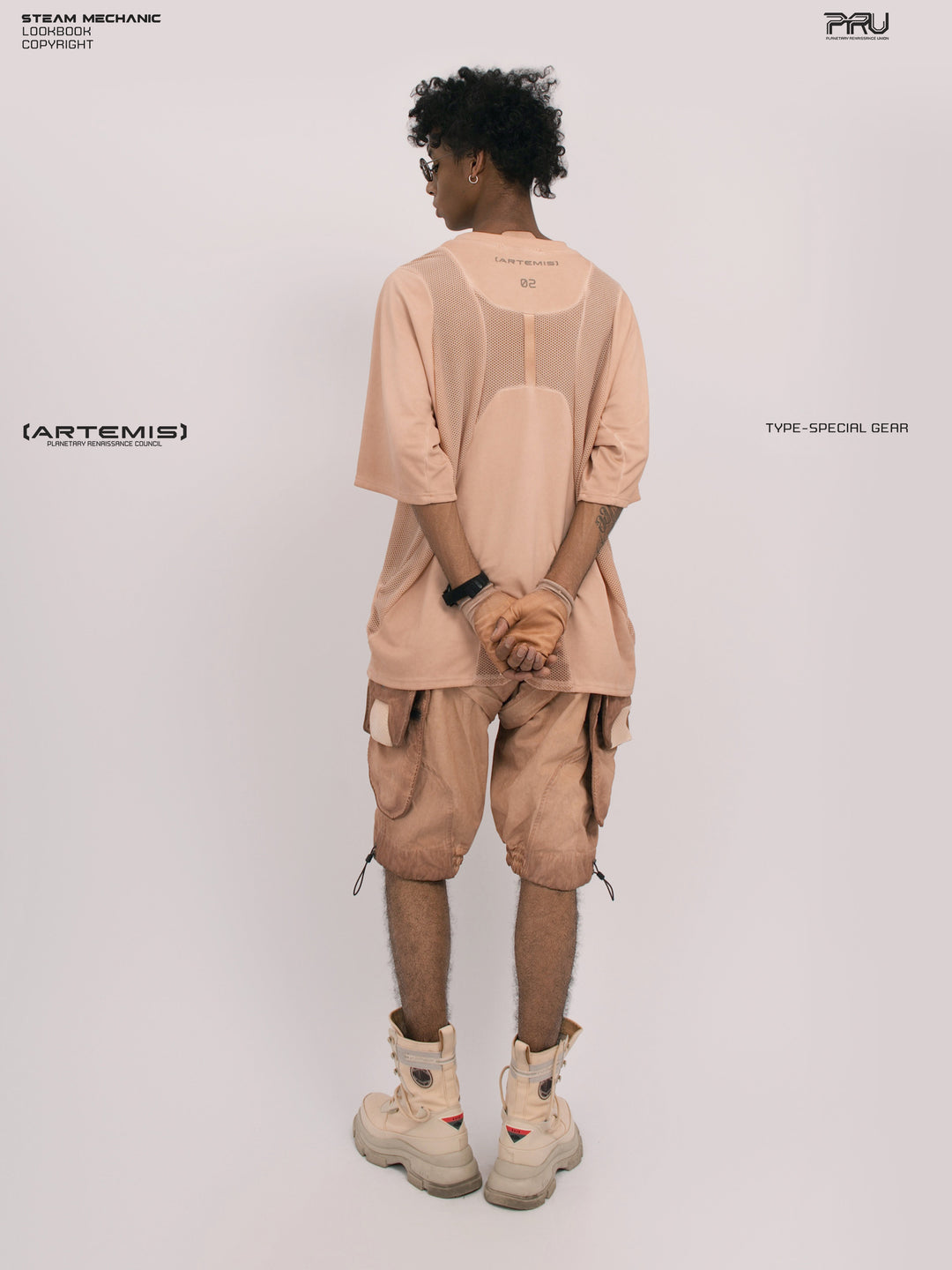 STARFIELD WELDER soft dawn orange distressed mesh tee — full-length back view with hands clasped