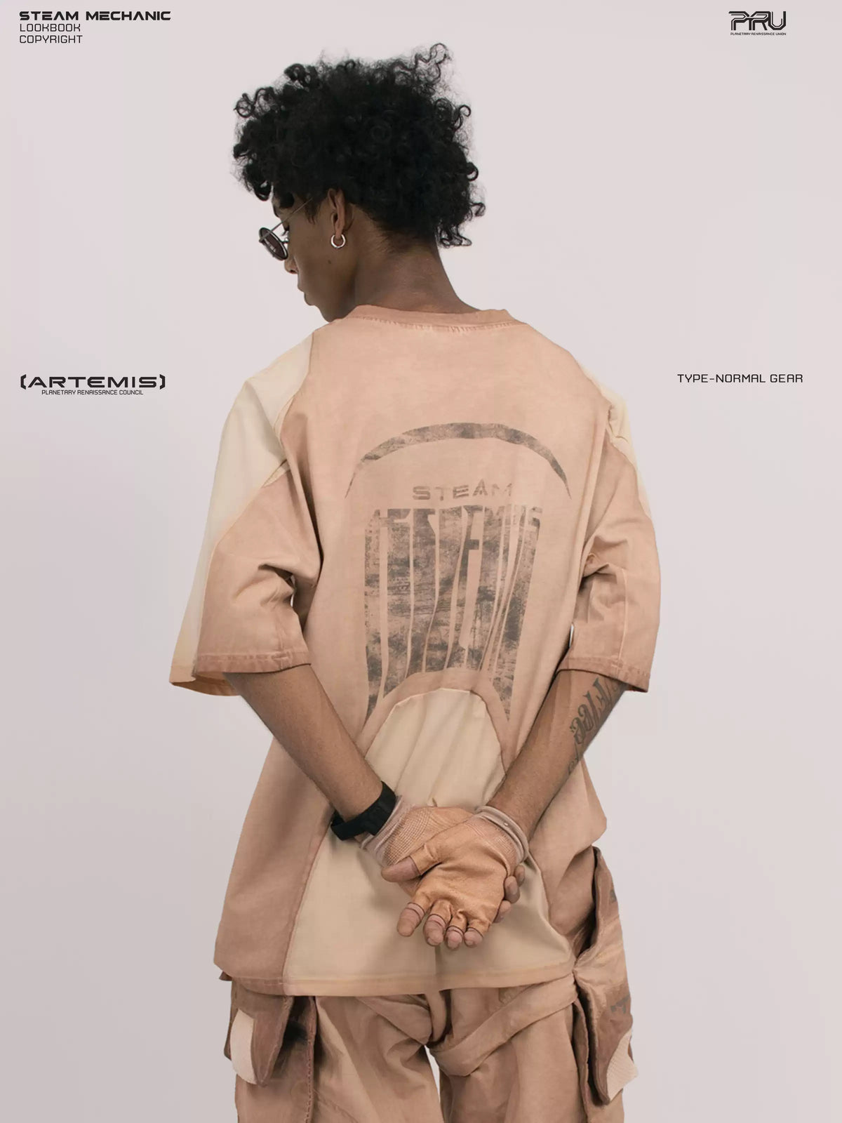 VOID soft dawn orange breathable technical tee — rear close-up with hand held behind the body