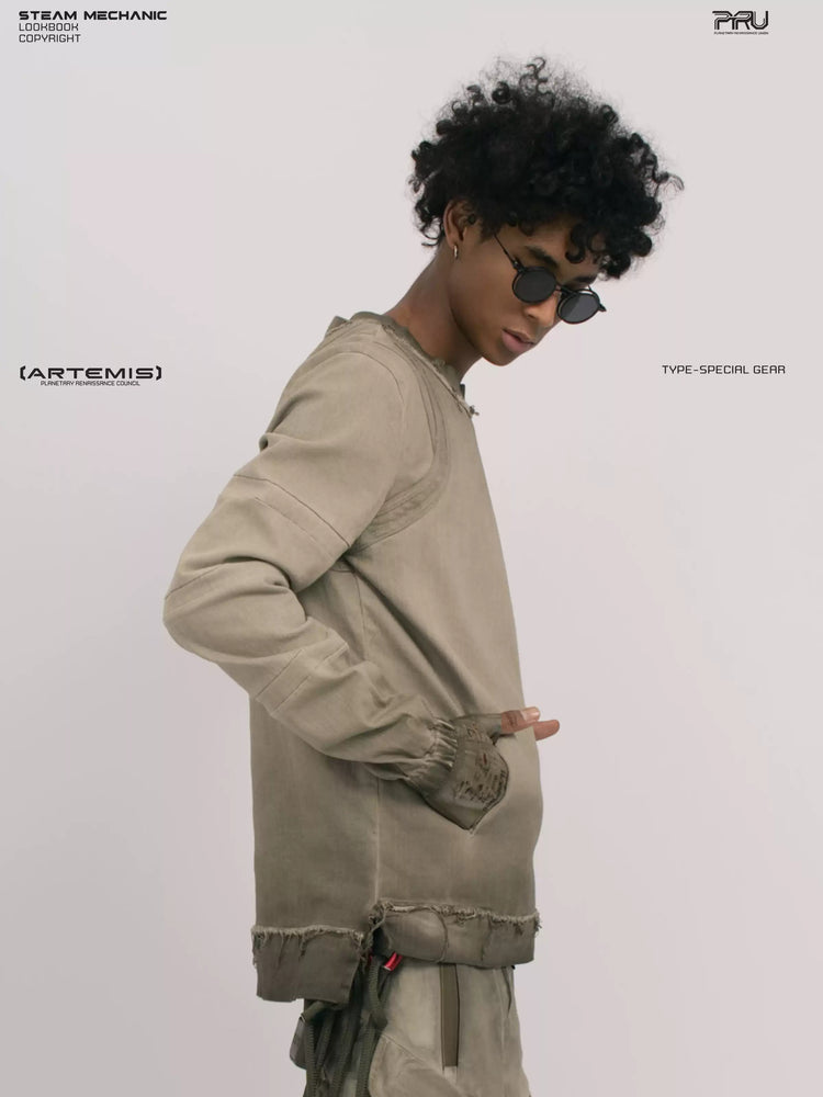 CHAOS ERA xirang brown raw-edge long-sleeve top — side modeled close-up with hand in pocket
