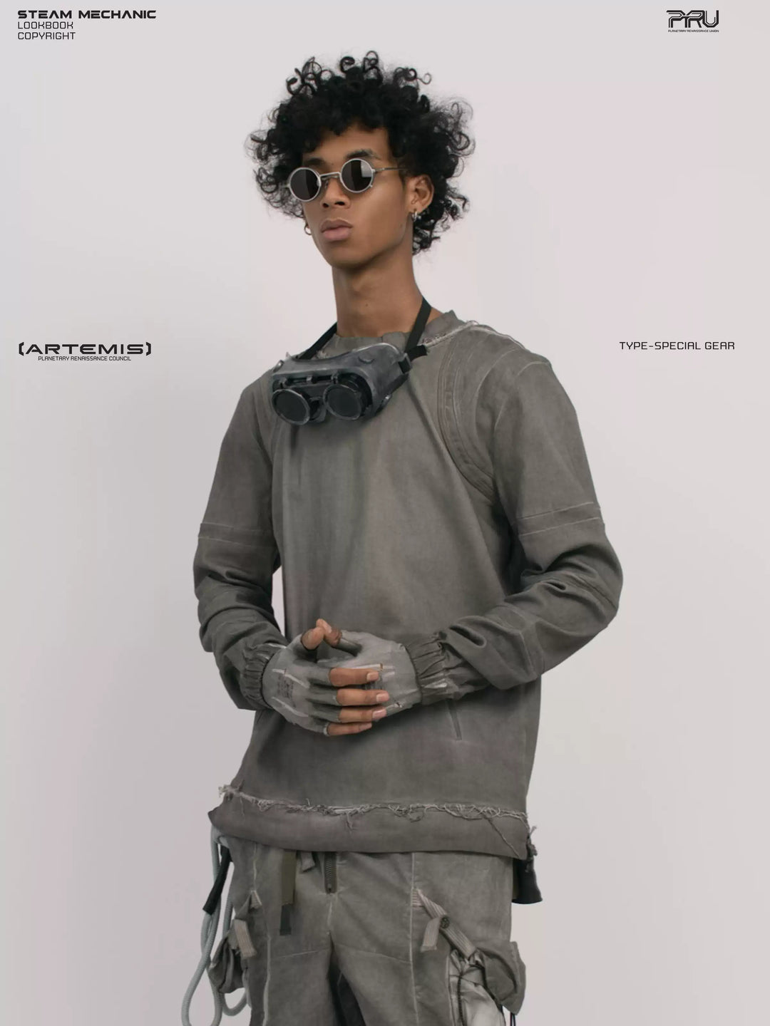 CHAOS ERA moon dust gray raw-edge long-sleeve top — three-quarter front modeled close-up with hands clasped