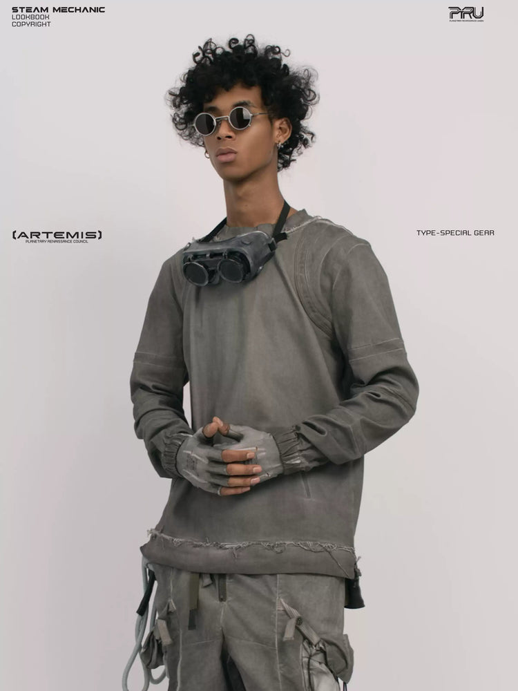 CHAOS ERA moon dust gray raw-edge long-sleeve top — three-quarter front modeled close-up with hands clasped