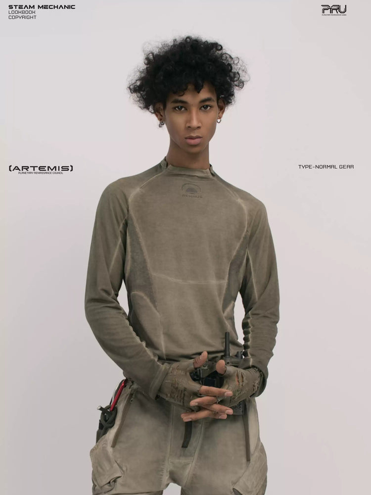 TWIN STAR lunar soil teal stretch riding base-layer top — front modeled close-up with hands clasped