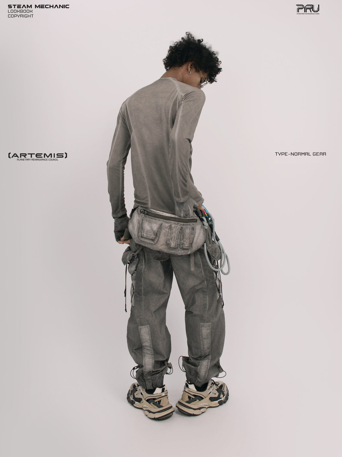 TWIN STAR meteor gray stretch riding base-layer top — full-length rear three-quarter view showing the sleeve fit