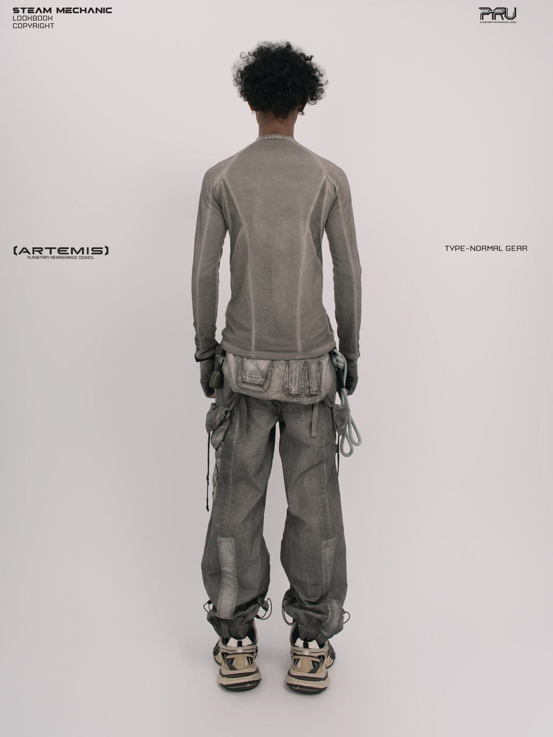 TWIN STAR meteor gray stretch riding base-layer top — full-length straight back view showing raglan panel seams