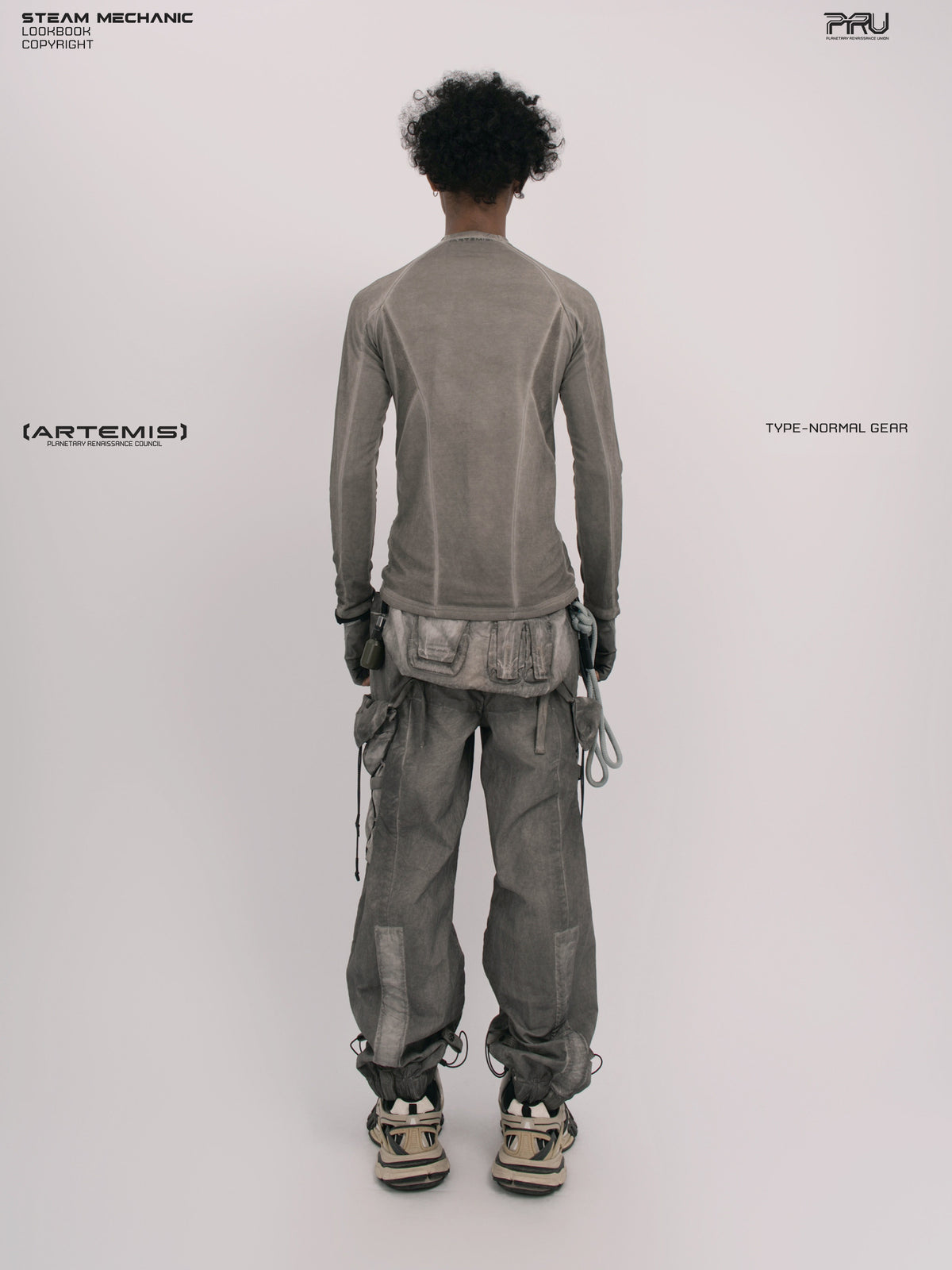 TWIN STAR meteor gray stretch riding base-layer top — full-length straight back view showing raglan panel seams