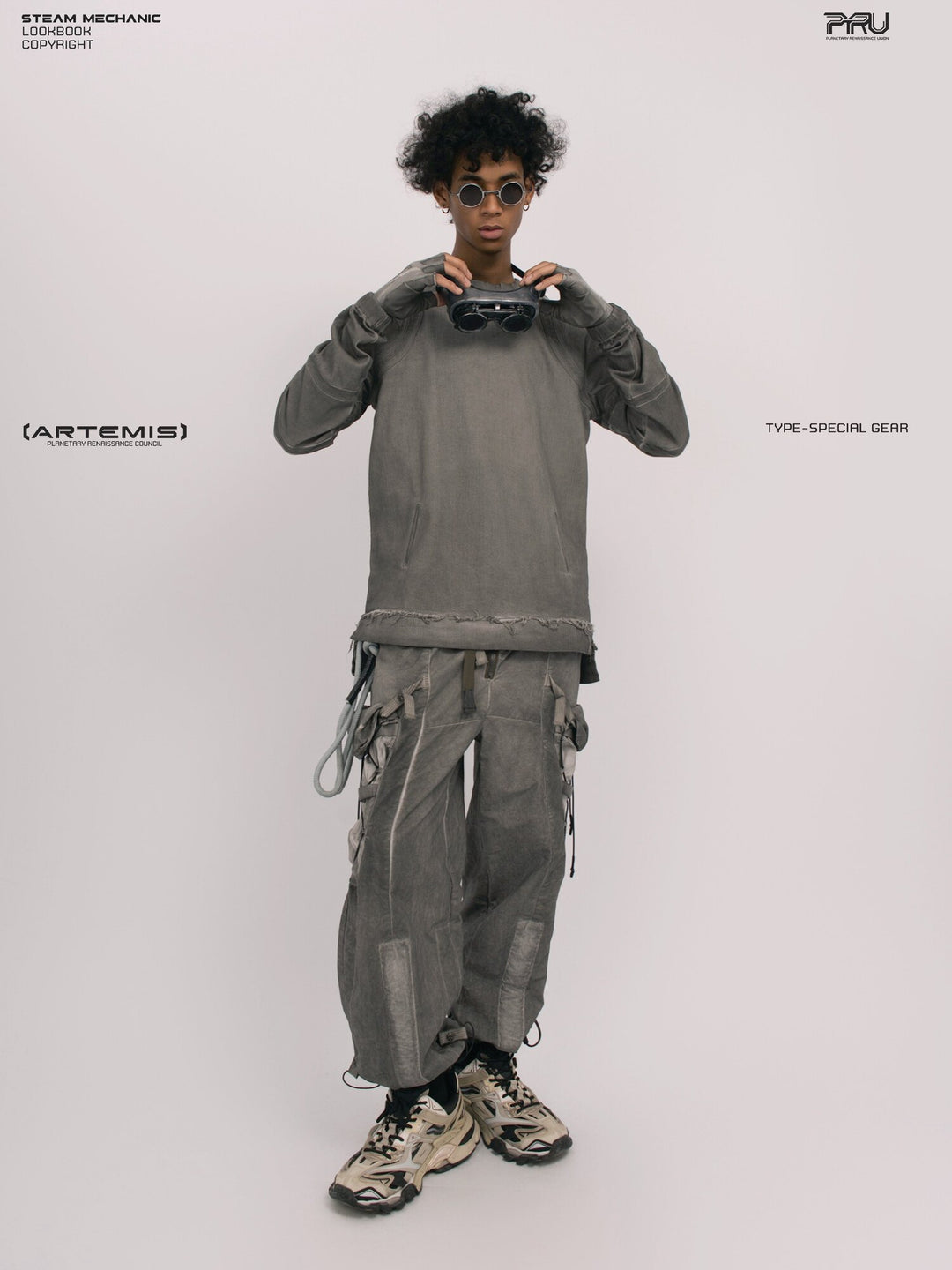 PIONEER detachable waist-pouch cargo pants in meteorite gray — full-length front modeled view with goggles raised