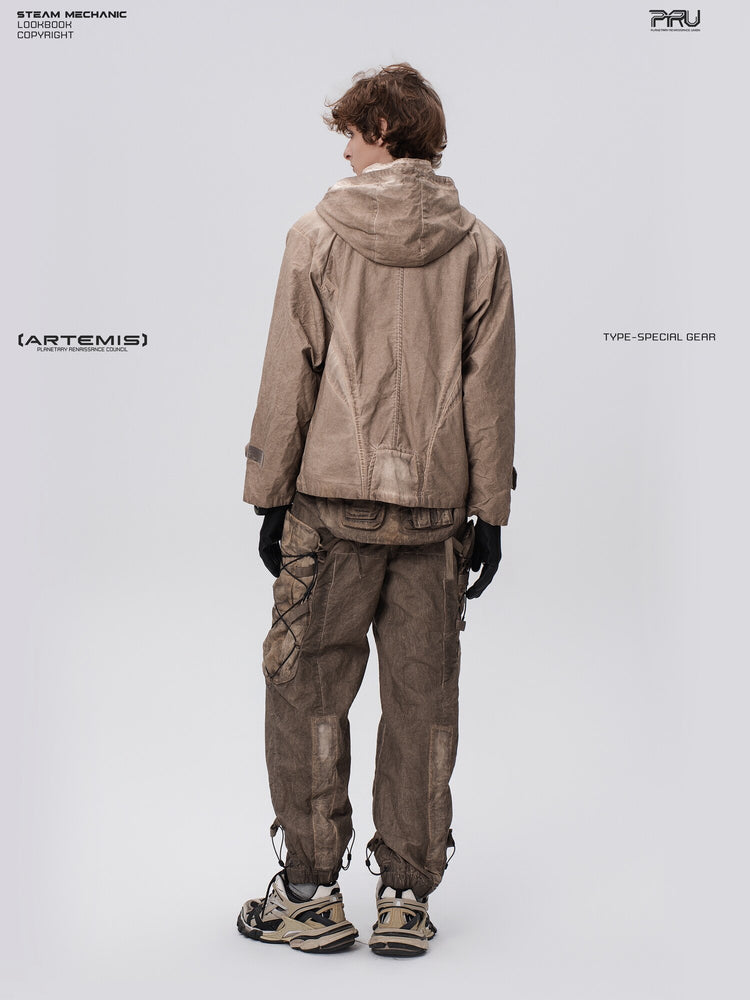 PIONEER detachable waist-pouch cargo pants in gravel brown — full-length rear view styled with a hooded jacket