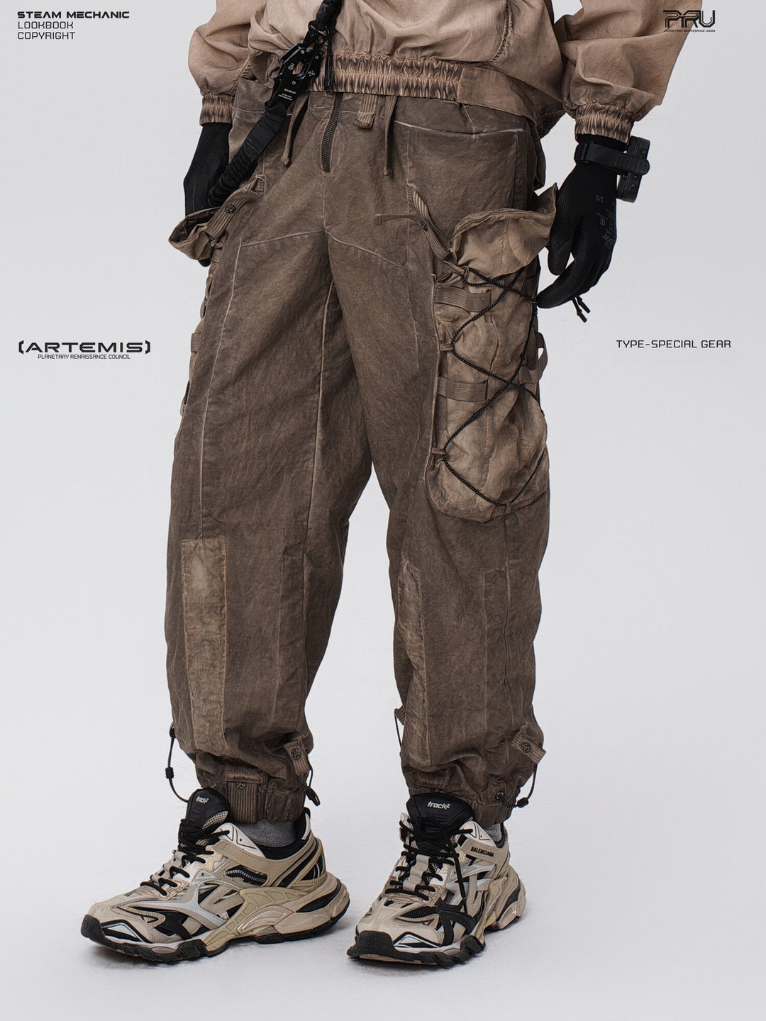PIONEER detachable waist-pouch cargo pants in gravel brown — three-quarter close-up showing the side pocket
