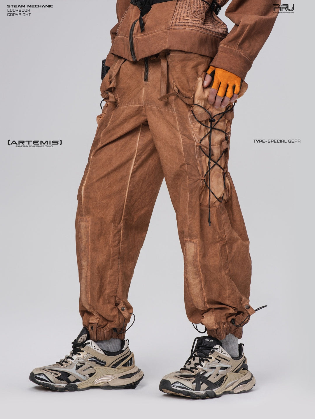 PIONEER detachable waist-pouch cargo pants in corona orange — opposite-side three-quarter close-up