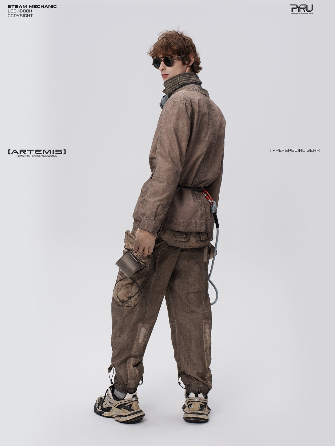 PIONEER detachable waist-pouch cargo pants in gravel brown — rear three-quarter full-length view