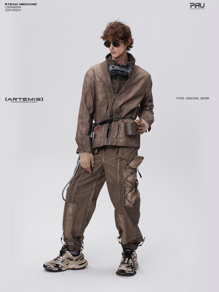 PIONEER detachable waist-pouch cargo pants in gravel brown — full-length three-quarter front view holding a cup