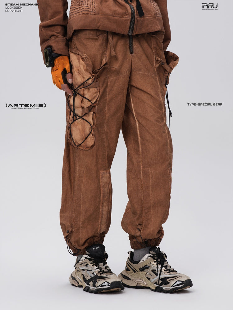 PIONEER detachable waist-pouch cargo pants in corona orange — three-quarter close-up showing pocket depth