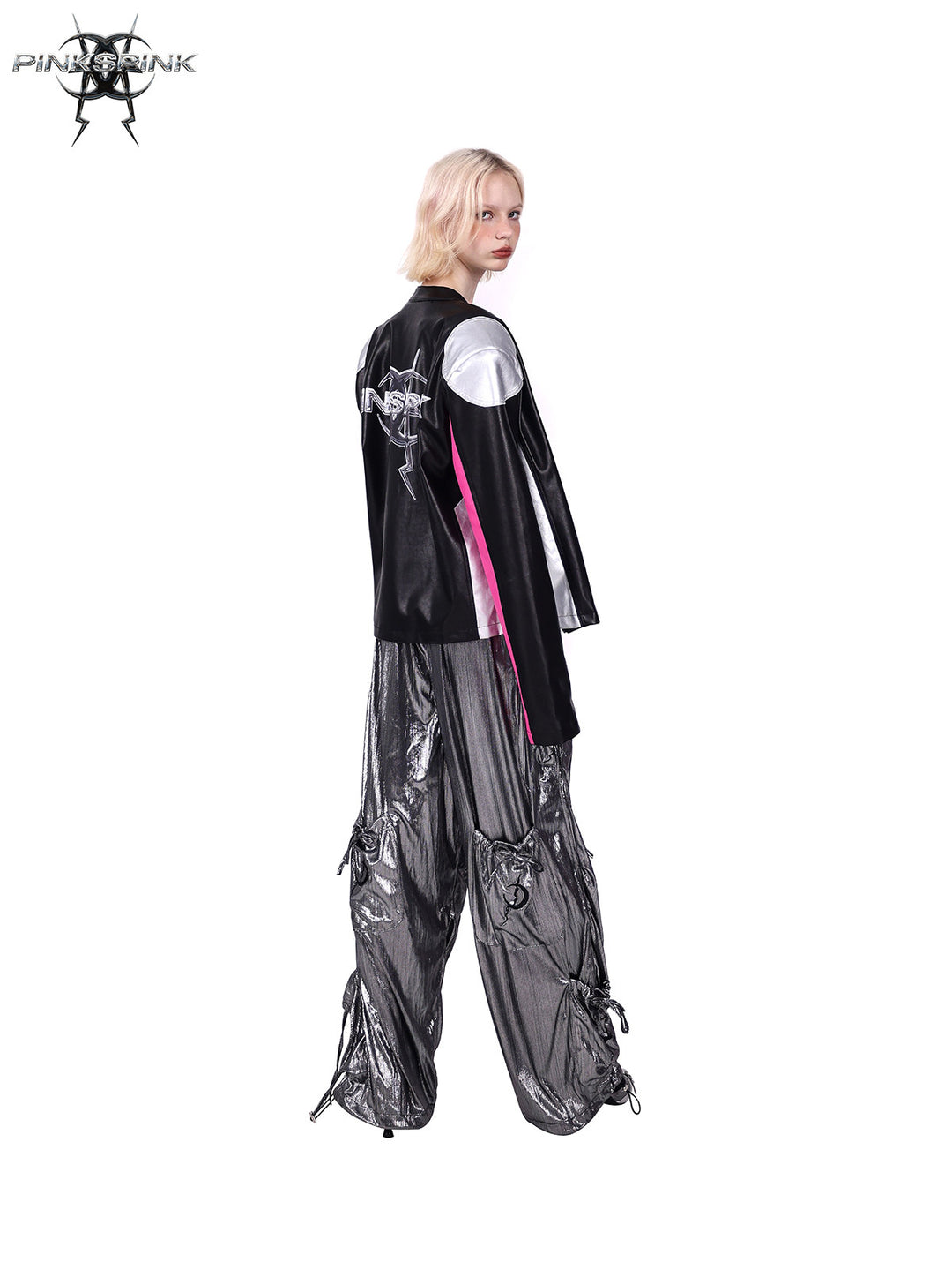 PINKSPINK MIRROR paneled faux-leather moto jacket in black silver pink — angled rear modeled view styled with metallic trousers