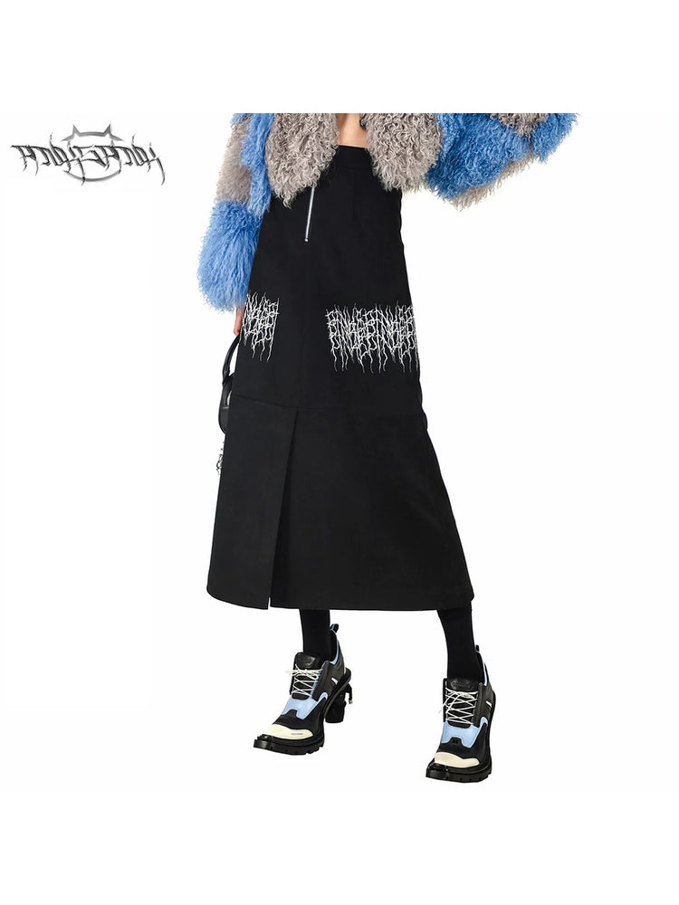 PINKSPINK ELECTRIC THORN embroidered suede-look midi skirt — black close-up showing the contrast thorn embroidery, front zipper and A-line hem