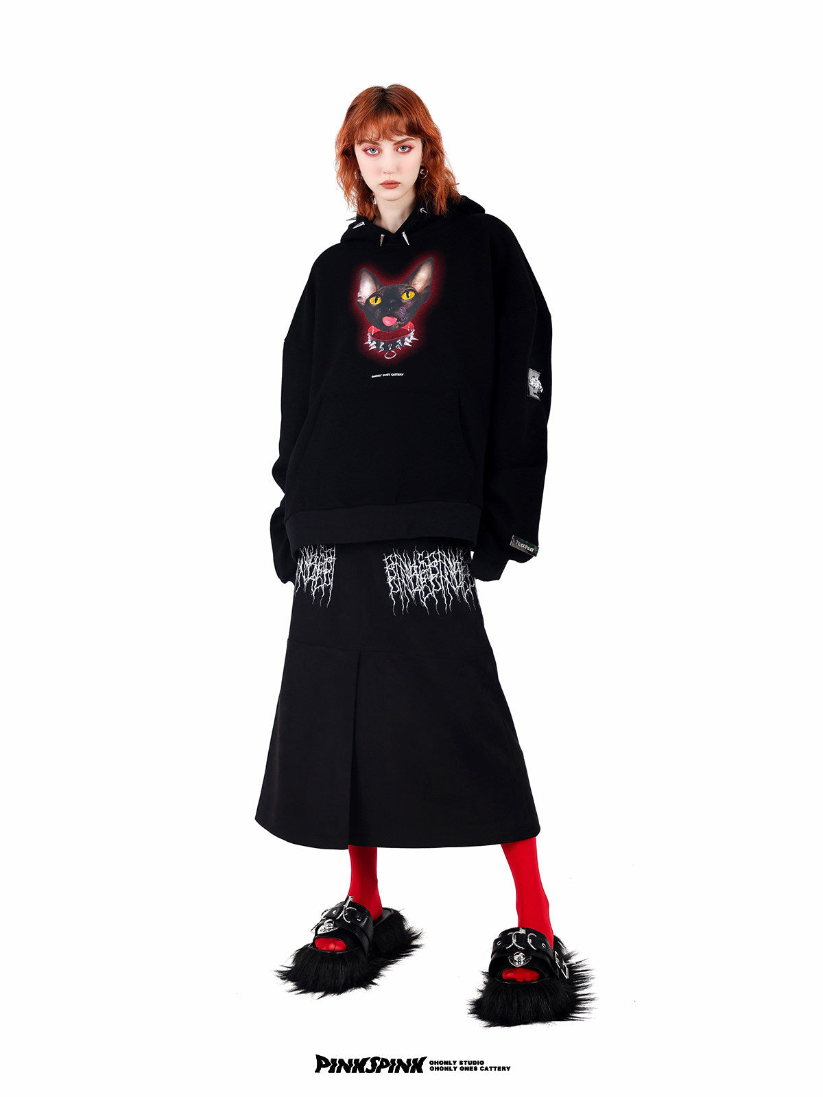 PINKSPINK ELECTRIC THORN embroidered suede-look midi skirt — black full-length front view styled with a graphic hoodie