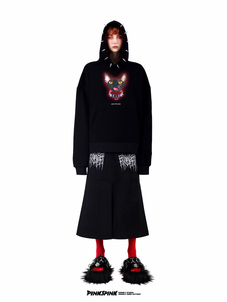 PINKSPINK ELECTRIC THORN embroidered suede-look midi skirt — black straight-on view styled with a spiked-hood graphic hoodie
