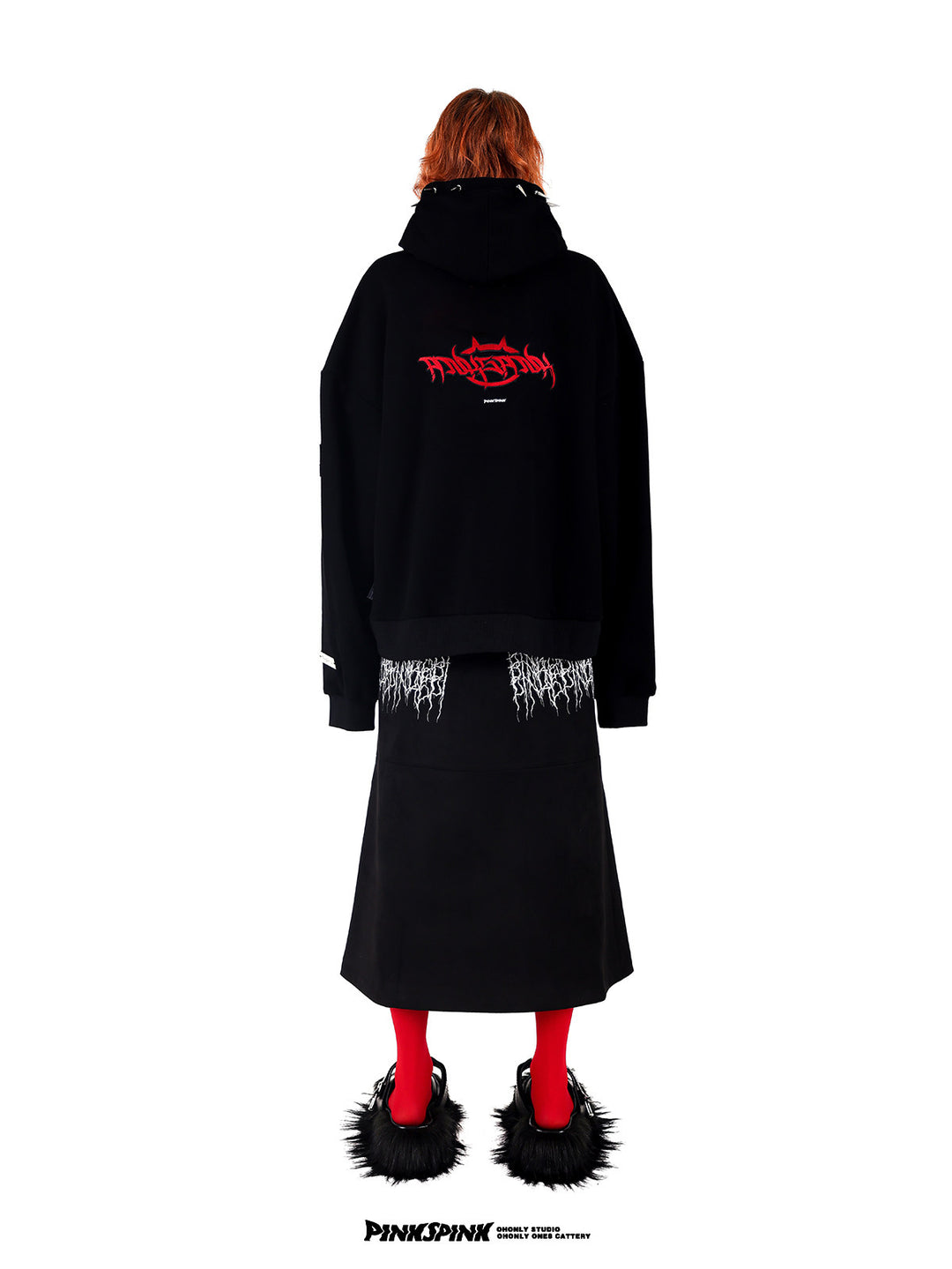 PINKSPINK ELECTRIC THORN embroidered suede-look midi skirt — black full-length rear view styled with a graphic hoodie