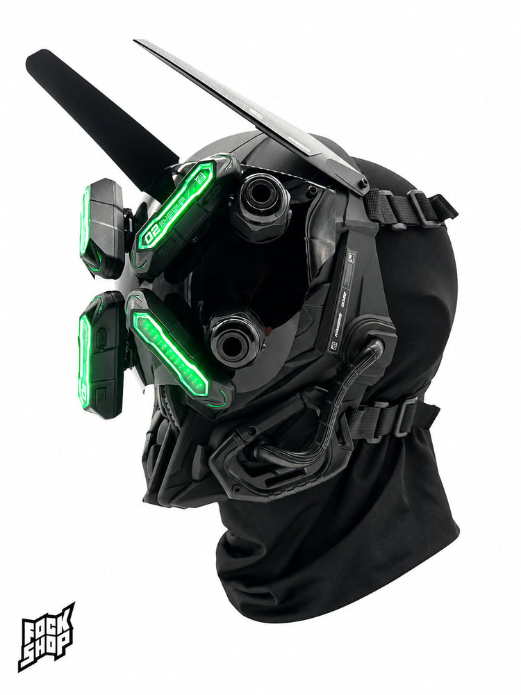 FOCKSHOP EYE II black illuminated cyber mask — green-lit three-quarter view with mounted decorative horns