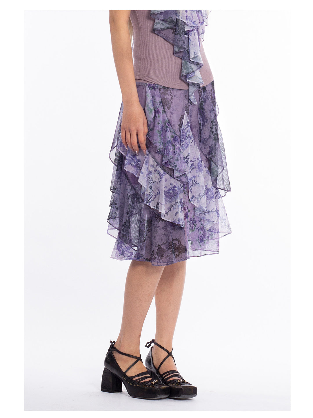 4RE1GN PURPLE HAZE asymmetric ruffle skirt in purple — modeled detail of the ruffled hem and floral panels