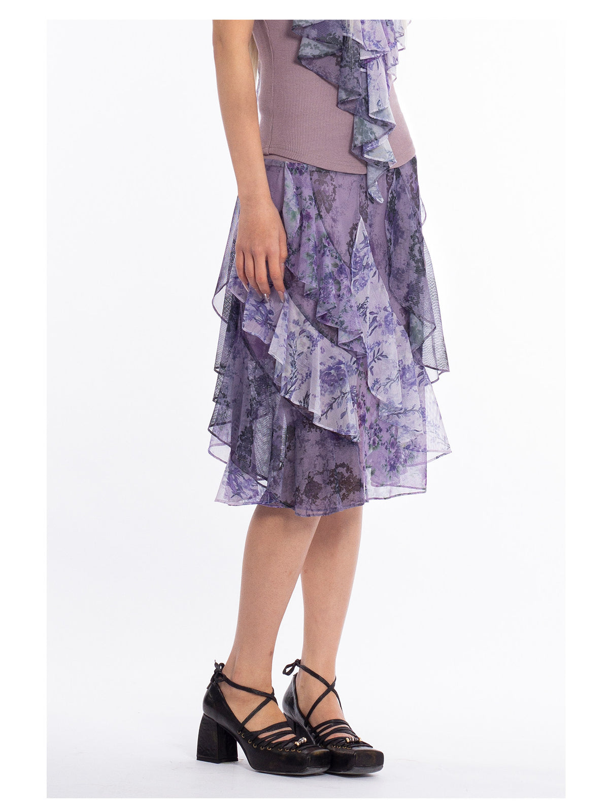4RE1GN PURPLE HAZE asymmetric ruffle skirt in purple — modeled detail of the ruffled hem and floral panels