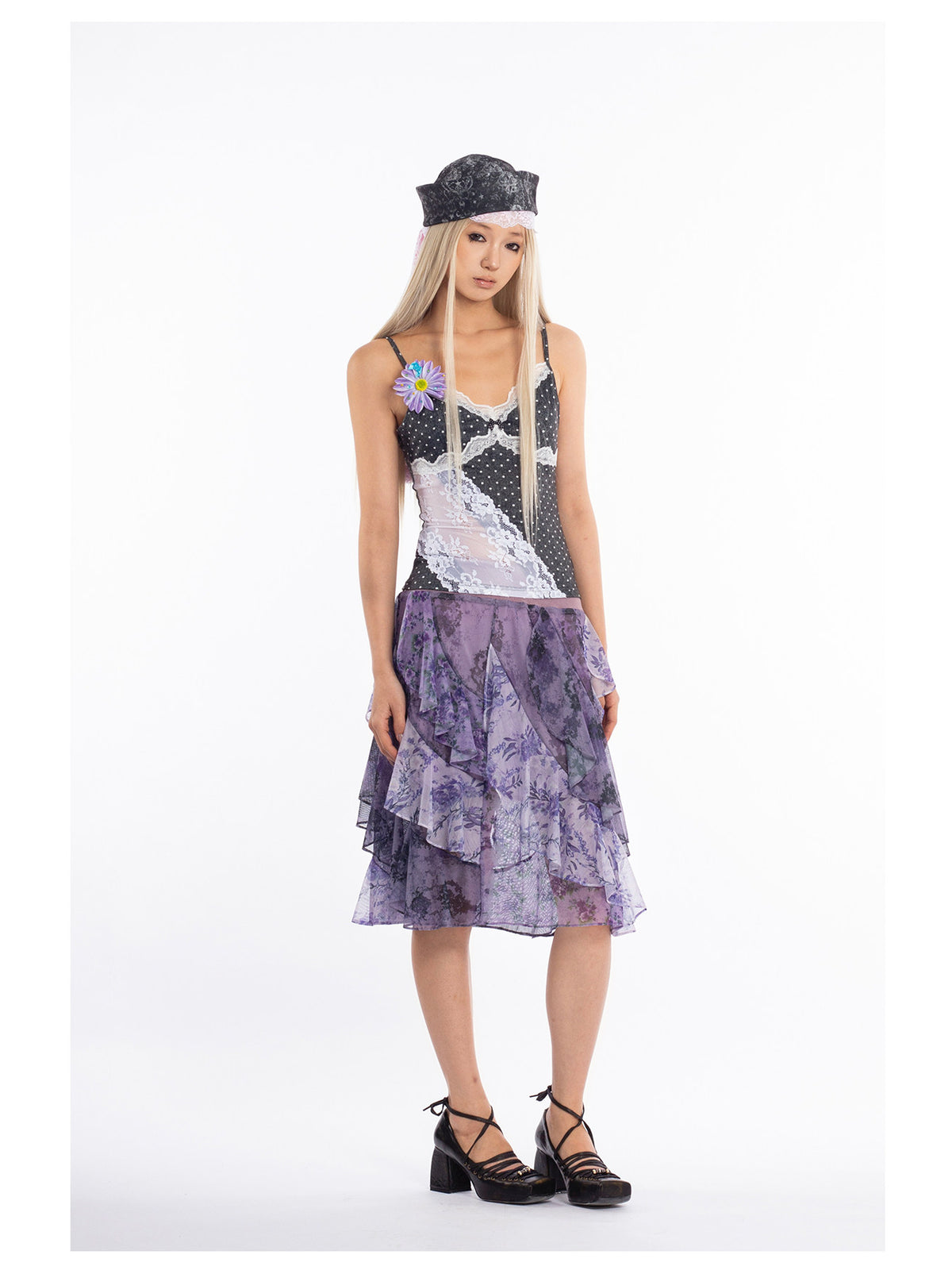 4RE1GN PURPLE HAZE asymmetric ruffle skirt in purple — front modeled view styled with a black-and-white lace camisole