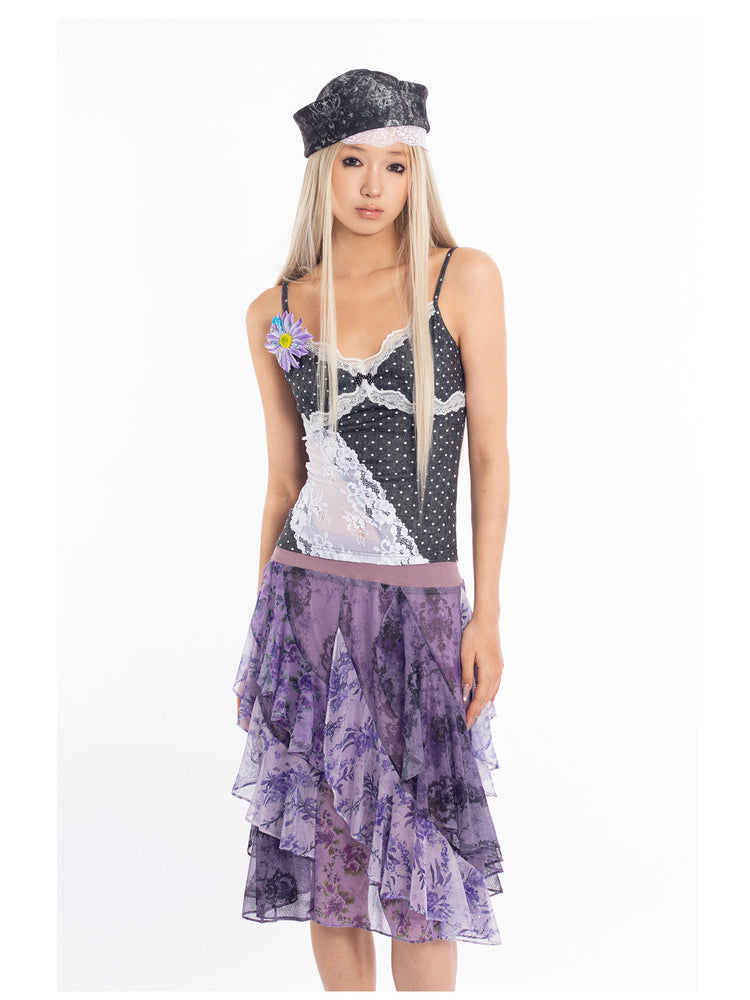 4RE1GN PURPLE HAZE asymmetric ruffle skirt in purple — close front modeled view showing the asymmetric layers