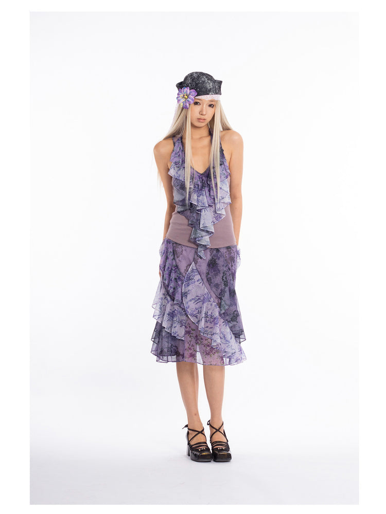 4RE1GN PURPLE HAZE asymmetric ruffle skirt in purple — front modeled view with hands behind the back