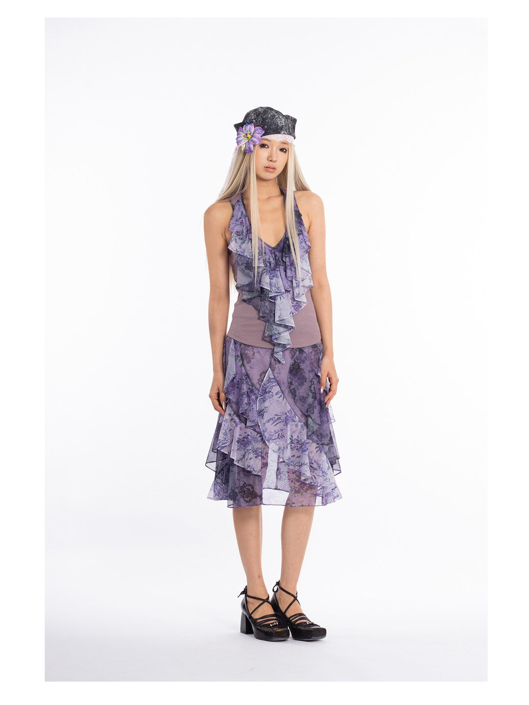 4RE1GN PURPLE HAZE asymmetric ruffle skirt in purple — front modeled view with arms down