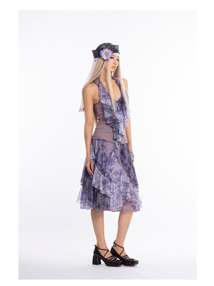 4RE1GN PURPLE HAZE asymmetric ruffle skirt in purple — full-length modeled view with head turned to the side