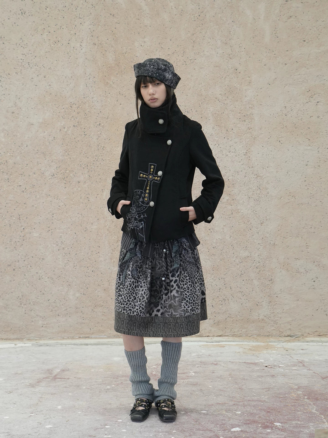 4RE1GN CROSS layered high-neck wool-blend jacket in black — full-length front modeled view with a gray printed skirt