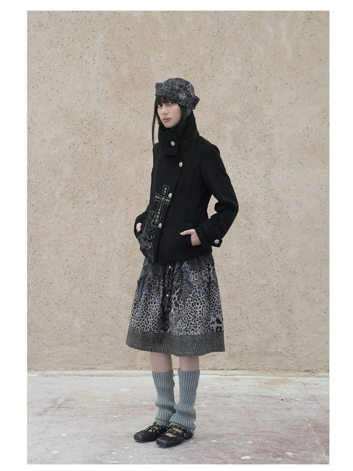 4RE1GN CROSS layered high-neck wool-blend jacket in black — full-length three-quarter modeled view with the outer collar fastened