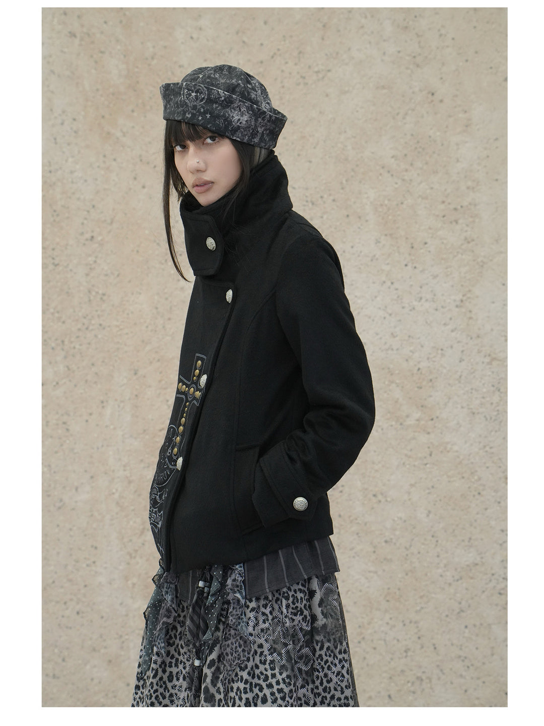 4RE1GN CROSS layered high-neck wool-blend jacket in black — front modeled close-up with the outer collar fastened upright