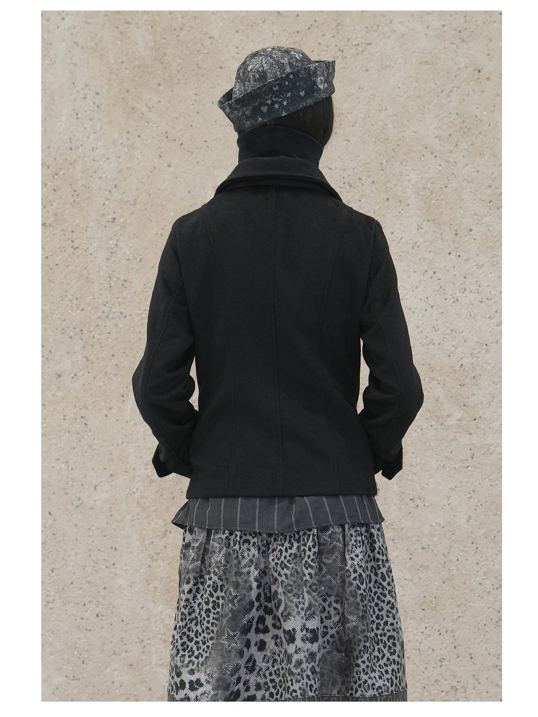 4RE1GN CROSS layered high-neck wool-blend jacket in black — back modeled close-up showing the plain wool-blend fabric and shaping