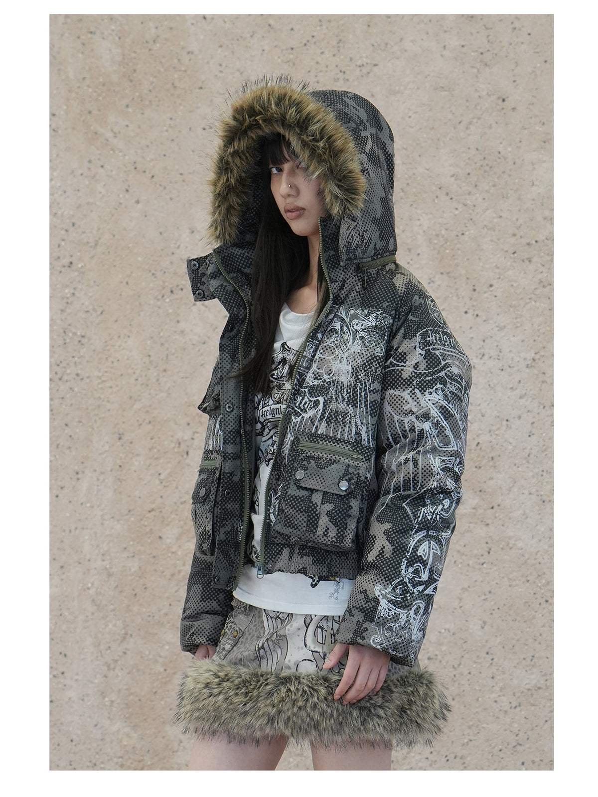 4RE1GN STAR CAMO hooded down jacket in gray green — three-quarter modeled view with the hood raised and front open
