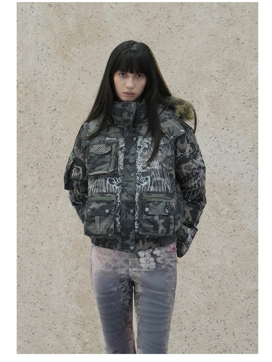 4RE1GN STAR CAMO hooded down jacket in gray green — front modeled view styled with gray printed trousers