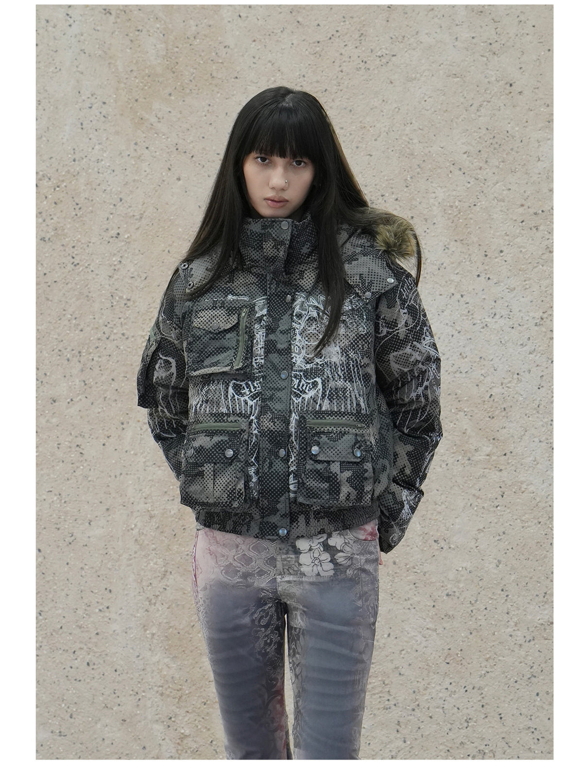4RE1GN STAR CAMO hooded down jacket in gray green — front modeled view styled with gray printed trousers
