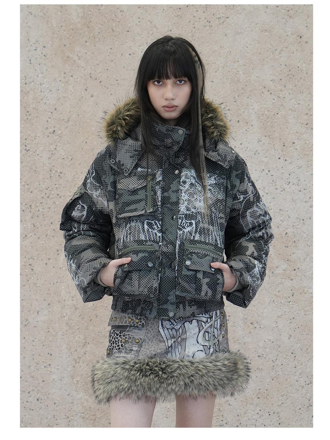 4RE1GN STAR CAMO hooded down jacket in gray green — front modeled close-up with hands in the pockets