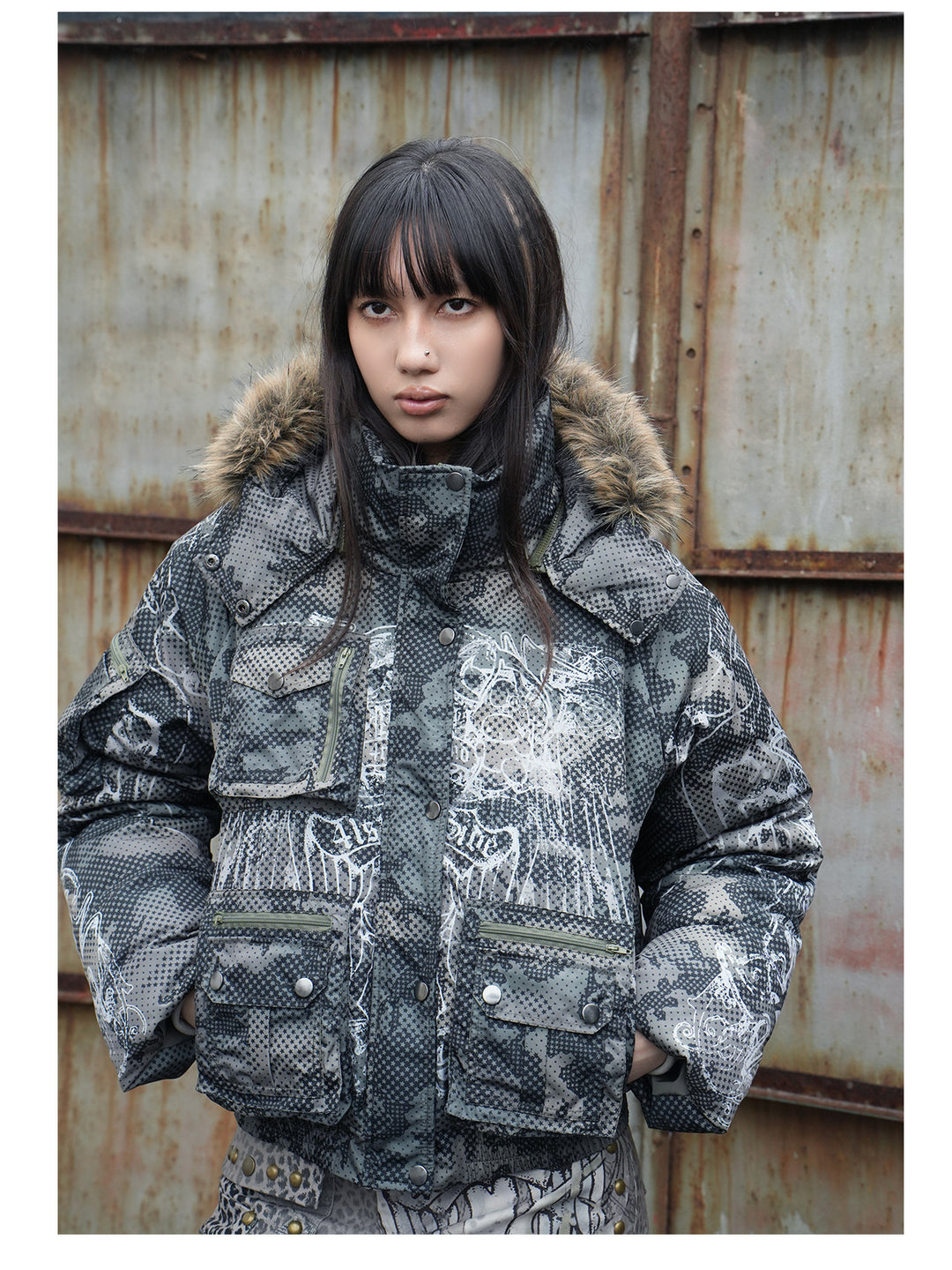 4RE1GN STAR CAMO hooded down jacket in gray green — front modeled close-up showing the pockets and print