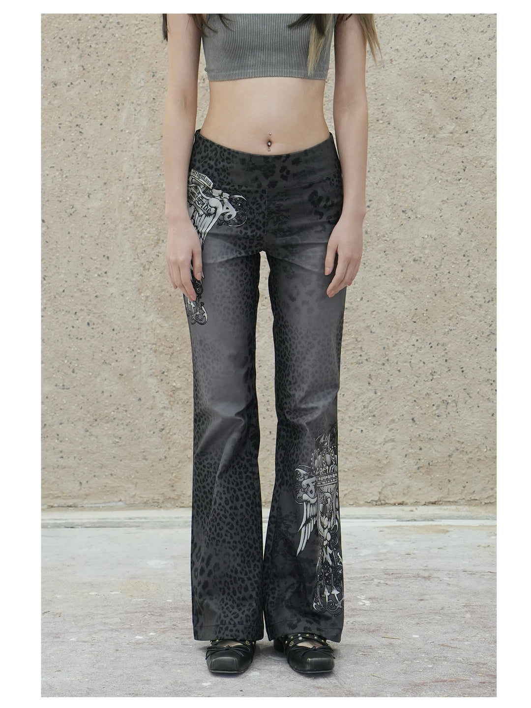 4RE1GN PANTHER crest-print corduroy flare pants in gray black — front modeled view showing the waist and crest placement