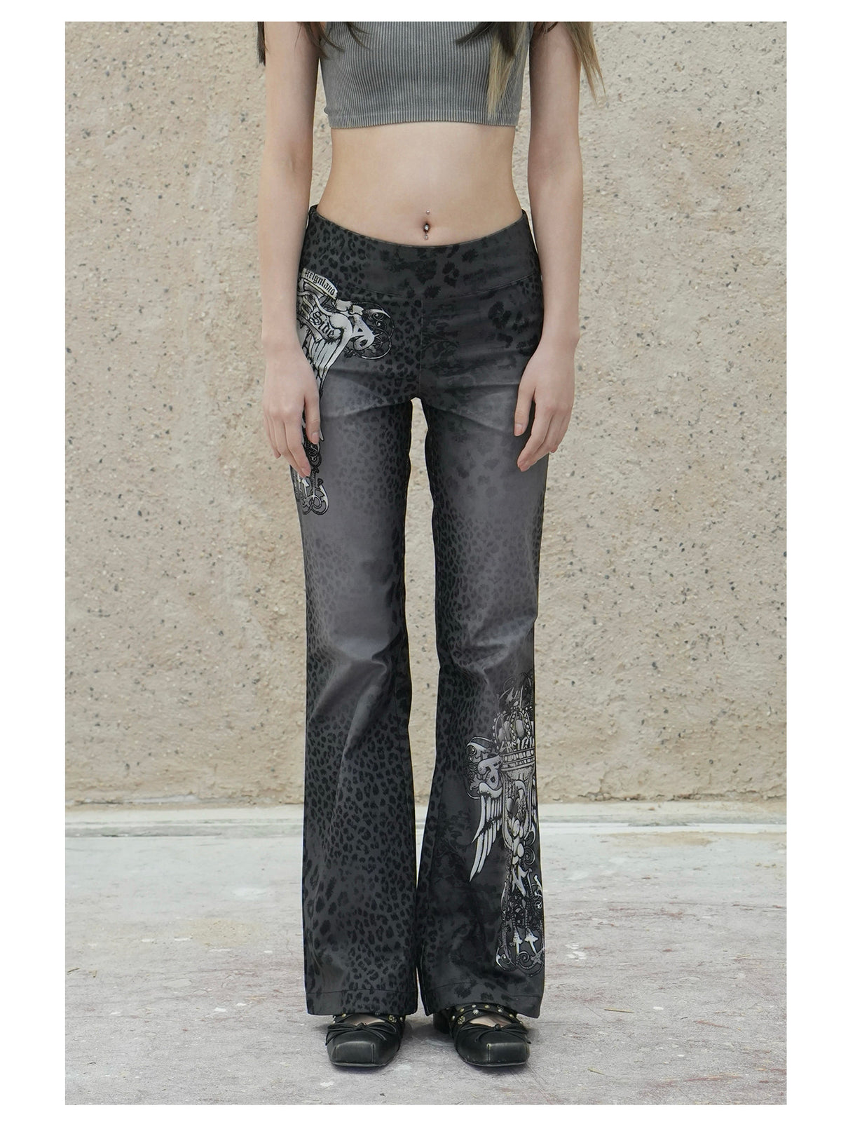 4RE1GN PANTHER crest-print corduroy flare pants in gray black — front modeled view showing the waist and crest placement