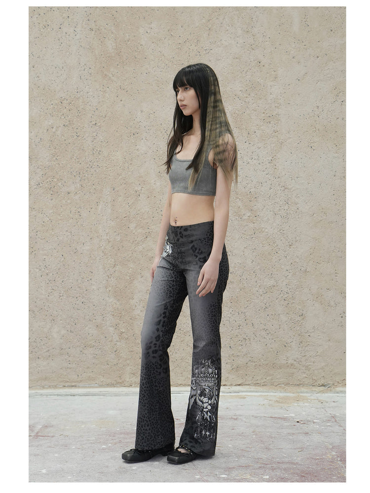 4RE1GN PANTHER crest-print corduroy flare pants in gray black — full-length front modeled view styled with a gray crop top