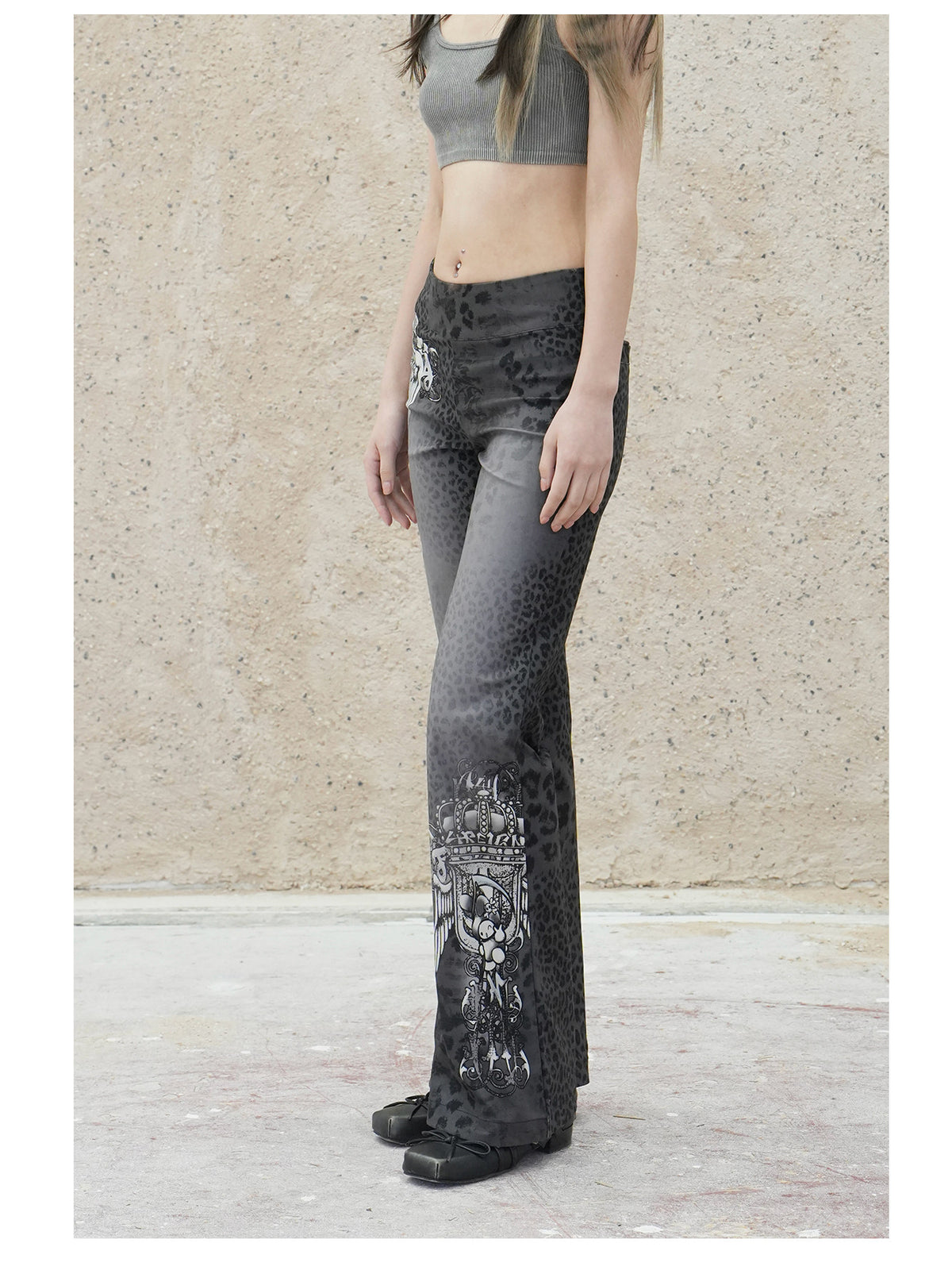 4RE1GN PANTHER crest-print corduroy flare pants in gray black — three-quarter modeled view showing the slim fit