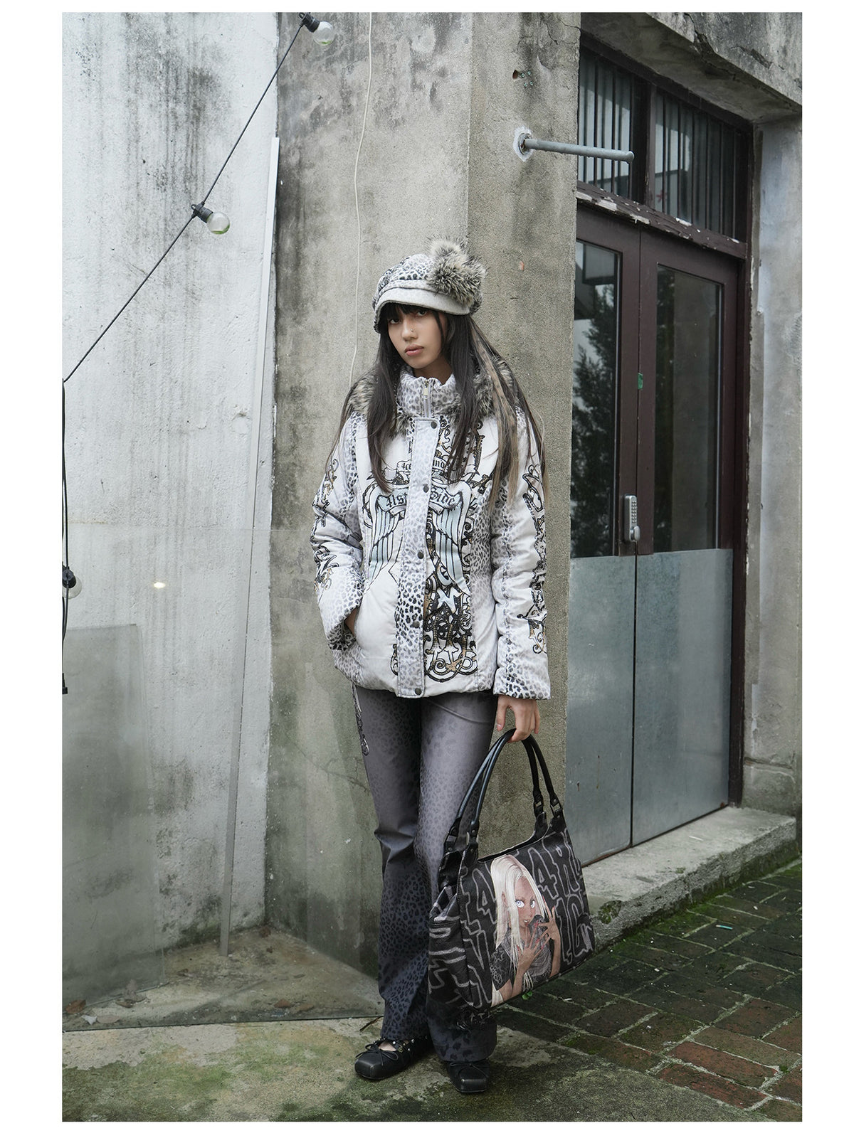 4RE1GN PANTHER crest-print corduroy flare pants in gray black — three-quarter modeled view with a white printed jacket and bag