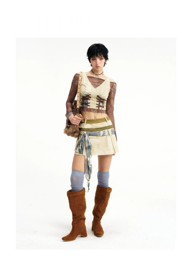 Front view of Next Passport double-lace vest and mini skirt set in denim green