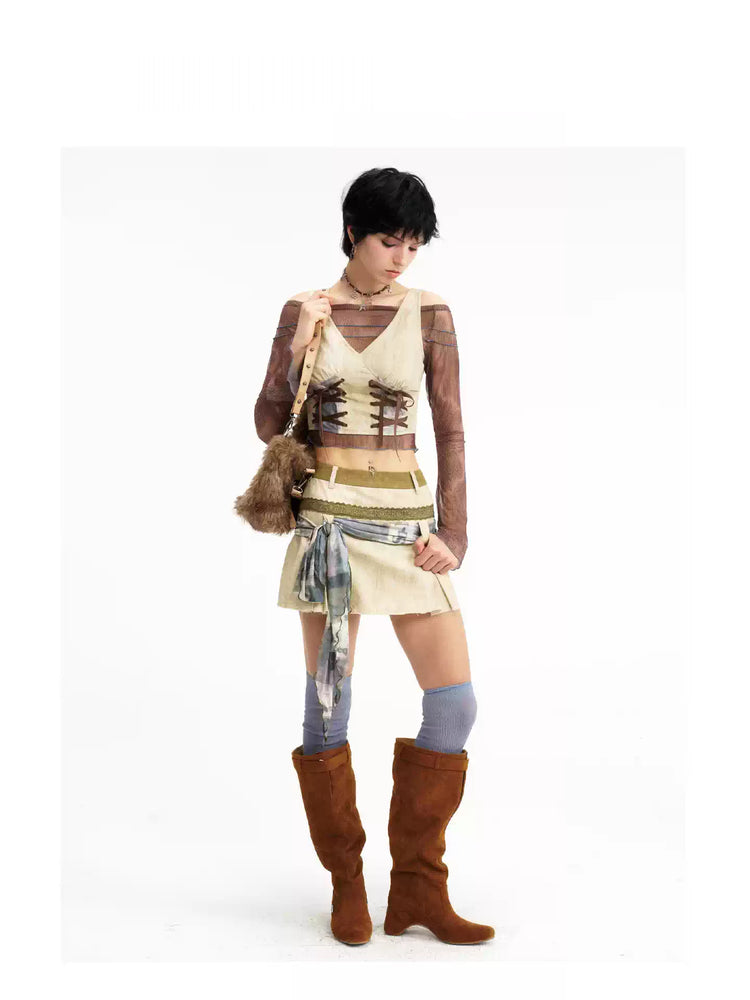 Modeled view of the double-lace vest and tie-detail skirt