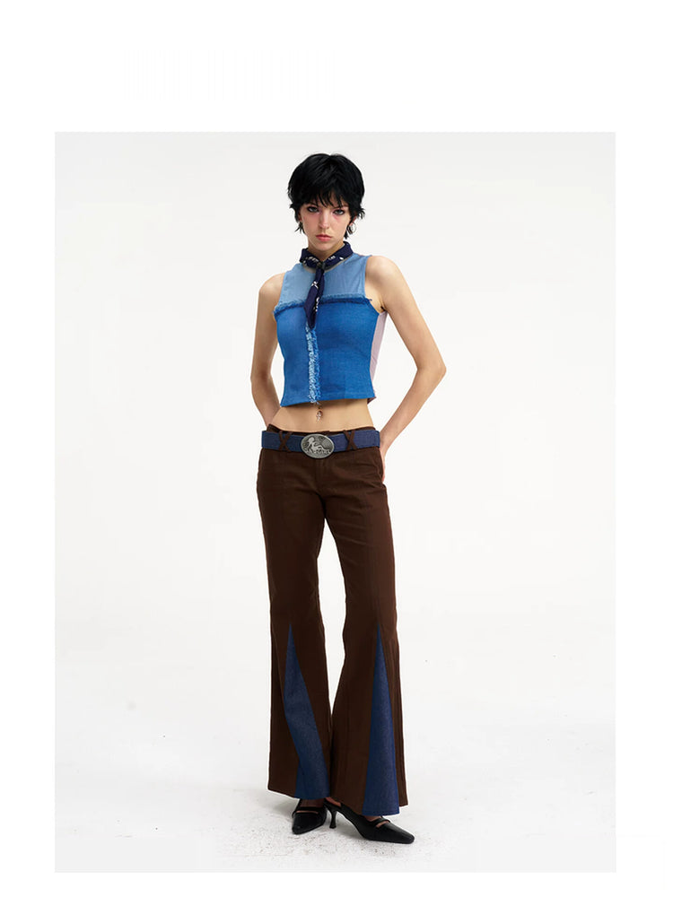 NEXT PASSPORT denim-panel low-rise flared pants in brown — full-length front modeled view showing the low waist and contrasting blue denim flares.