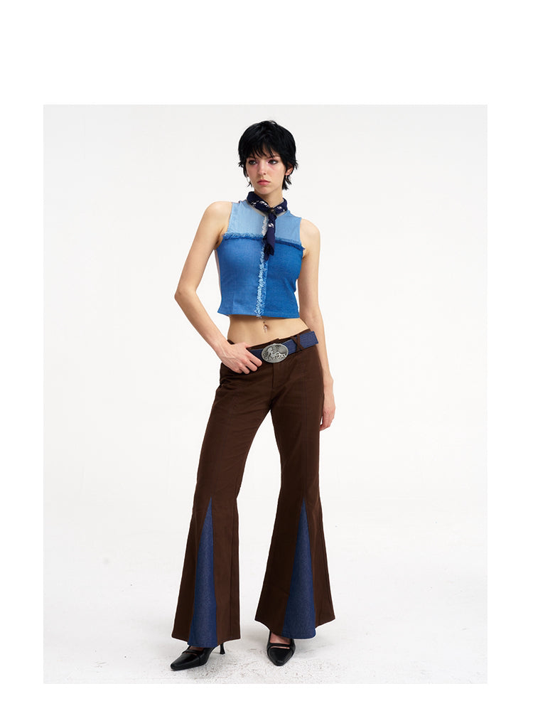 NEXT PASSPORT denim-panel low-rise flared pants in brown — front angled with hand at the waist modeled view.
