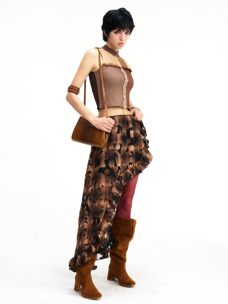 Brown plaid skirt overlay styled over trousers, full-length view